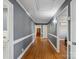 Hallway featuring hardwood floors and neutral wall colors at 7617 Pleasant Hill Church Rd, Marshville, NC 28103