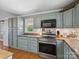 Spacious kitchen with stainless steel appliances and custom-color cabinets at 7617 Pleasant Hill Church Rd, Marshville, NC 28103