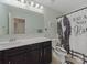 Bathroom with double sink vanity and unique shower curtain at 807 Oak Manor Se Dr, Concord, NC 28025