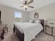 Bedroom features neutral walls, carpet, large window and ceiling fan at 807 Oak Manor Se Dr, Concord, NC 28025