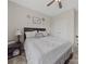 Cozy bedroom with a wooden bed frame, soft lighting, and a decorative floral theme at 807 Oak Manor Se Dr, Concord, NC 28025