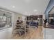 Cozy dining area with views of the outdoor deck and kitchen at 807 Oak Manor Se Dr, Concord, NC 28025