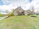 Home with a lush green lawn in a sidewalk community and a basketball hoop at 807 Oak Manor Se Dr, Concord, NC 28025