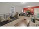 Spacious living room features neutral and red walls, modern flooring and an aquarium at 807 Oak Manor Se Dr, Concord, NC 28025