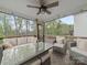 Covered porch with plush seating, string lights and ceiling fan at 807 Oak Manor Se Dr, Concord, NC 28025