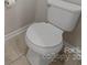 A clean, white toilet in a well-maintained bathroom at 807 Oak Manor Se Dr, Concord, NC 28025