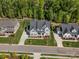 Overhead view of the home with pristine landscaping, a long driveway, and well-maintained lawn at 811 Penny Royal Ave, Fort Mill, SC 29715