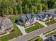 Overhead view highlighting home's setting within a neighborhood, displaying its well-kept lawn and landscaping at 811 Penny Royal Ave, Fort Mill, SC 29715