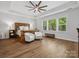 Spacious primary bedroom with a tray ceiling, ample natural light, and stylish decor for a relaxing retreat at 811 Penny Royal Ave, Fort Mill, SC 29715