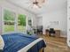 Bright bedroom featuring a bunk bed, wooden desk, and a large window that offers an inviting view at 811 Penny Royal Ave, Fort Mill, SC 29715