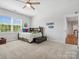 Bedroom with a daybed, ceiling fan, and large window providing natural light at 811 Penny Royal Ave, Fort Mill, SC 29715