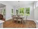 Bright dining area featuring a modern chandelier and large windows with a view of the outdoors at 811 Penny Royal Ave, Fort Mill, SC 29715