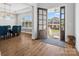 Spacious entryway with hardwood floors and view into the dining area, open front door at 811 Penny Royal Ave, Fort Mill, SC 29715