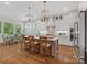 Bright kitchen features a large island with seating, stainless steel appliances, and pendant lighting at 811 Penny Royal Ave, Fort Mill, SC 29715