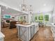 Spacious kitchen with a large island, open to the living and dining areas for easy entertaining at 811 Penny Royal Ave, Fort Mill, SC 29715