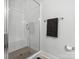 Elegant shower with white subway tile, a glass door, and a built-in bench for added convenience at 811 Penny Royal Ave, Fort Mill, SC 29715