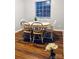 Dining room features a wooden table with chairs and a large window, providing a comfortable and well-lit space at 9404 Robert Burns Ct, Charlotte, NC 28213