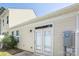 View of the rear exterior with a door, a meter, and a window at 101 N Ferncliff Dr, Mount Holly, NC 28120