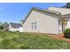 Exterior shot of backyard showing the vinyl siding and lawn at 101 N Ferncliff Dr, Mount Holly, NC 28120