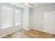 Bright bedroom features hardwood floors and large windows for natural light at 101 N Ferncliff Dr, Mount Holly, NC 28120