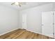 Bedroom featuring wood-look floors, light walls, and white doors at 101 N Ferncliff Dr, Mount Holly, NC 28120