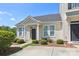 Charming one-story home featuring a welcoming front porch and beautifully landscaped front yard at 101 N Ferncliff Dr, Mount Holly, NC 28120