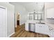 Open kitchen with white cabinets, stainless steel appliances, and views of the living area at 101 N Ferncliff Dr, Mount Holly, NC 28120