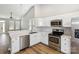 Bright kitchen showcasing white cabinets, stainless steel appliances, and an open layout at 101 N Ferncliff Dr, Mount Holly, NC 28120