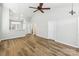Open-concept living space features vaulted ceilings, light walls, and wood-look floors at 101 N Ferncliff Dr, Mount Holly, NC 28120