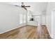 Bright, open living area featuring a breakfast bar and wood-look floors at 101 N Ferncliff Dr, Mount Holly, NC 28120