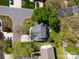 Aerial view showcasing a well-maintained home, mature trees, and a spacious backyard, highlighting the property's curb appeal at 103 Claremont Way, Mooresville, NC 28117