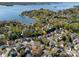 Stunning aerial view of lakeside homes with lush green trees and beautiful Lake Norman waterfront at 103 Claremont Way, Mooresville, NC 28117
