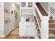 Hallway bar featuring shelving, stemware storage, and wine rack at 103 Claremont Way, Mooresville, NC 28117
