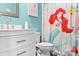 Charming bathroom features playful 'Little Mermaid' themed decor, bright blue walls, and a stylish vanity at 103 Claremont Way, Mooresville, NC 28117