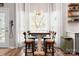 Bright breakfast nook featuring a modern light fixture and views from the surrounding windows at 103 Claremont Way, Mooresville, NC 28117