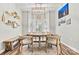 Charming dining room with a rustic table, stylish chairs, and a bay window at 103 Claremont Way, Mooresville, NC 28117