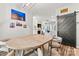 Cozy dining area next to the living room with natural light and modern decor at 103 Claremont Way, Mooresville, NC 28117