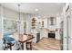 Modern kitchen features stainless steel appliances, white cabinets and a view of dining area at 103 Claremont Way, Mooresville, NC 28117