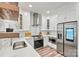 Well-equipped kitchen boasts stainless steel appliances, white cabinets, and a modern design at 103 Claremont Way, Mooresville, NC 28117