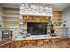 Stone fireplace with built-in shelving, offering a cozy focal point at 109 Canterbury Ln, Matthews, NC 28104