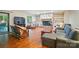 Cozy living room with stone fireplace, built-in shelving, and ample seating at 109 Canterbury Ln, Matthews, NC 28104