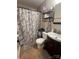 Functional bathroom showcasing a shower with patterned curtain and vanity at 109 Wilson Acres Dr, Kings Mountain, NC 28086