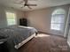 Serene bedroom featuring two large windows and carpet flooring at 109 Wilson Acres Dr, Kings Mountain, NC 28086