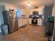 Well-lit kitchen with white cabinets, stainless steel appliances, and tile flooring at 109 Wilson Acres Dr, Kings Mountain, NC 28086