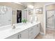 Bright bathroom features a double vanity, walk-in closet, and a separate glass-enclosed shower at 11346 Olde Turnbury Ct, Charlotte, NC 28277