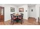 Cozy dining area featuring a round wooden table, comfortable chairs, and stylish decor at 11346 Olde Turnbury Ct, Charlotte, NC 28277
