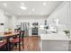 Bright kitchen with stainless steel appliances, white cabinetry, recessed lighting, and an eat-in area at 11346 Olde Turnbury Ct, Charlotte, NC 28277