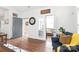 Cozy living room featuring hardwood floors, with a view to the backyard at 11346 Olde Turnbury Ct, Charlotte, NC 28277