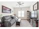 Inviting living room with comfortable seating, ample lighting, and a decorative display case at 11346 Olde Turnbury Ct, Charlotte, NC 28277