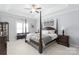 Spacious main bedroom with four-poster bed, ceiling fan, and elegant decor at 11346 Olde Turnbury Ct, Charlotte, NC 28277